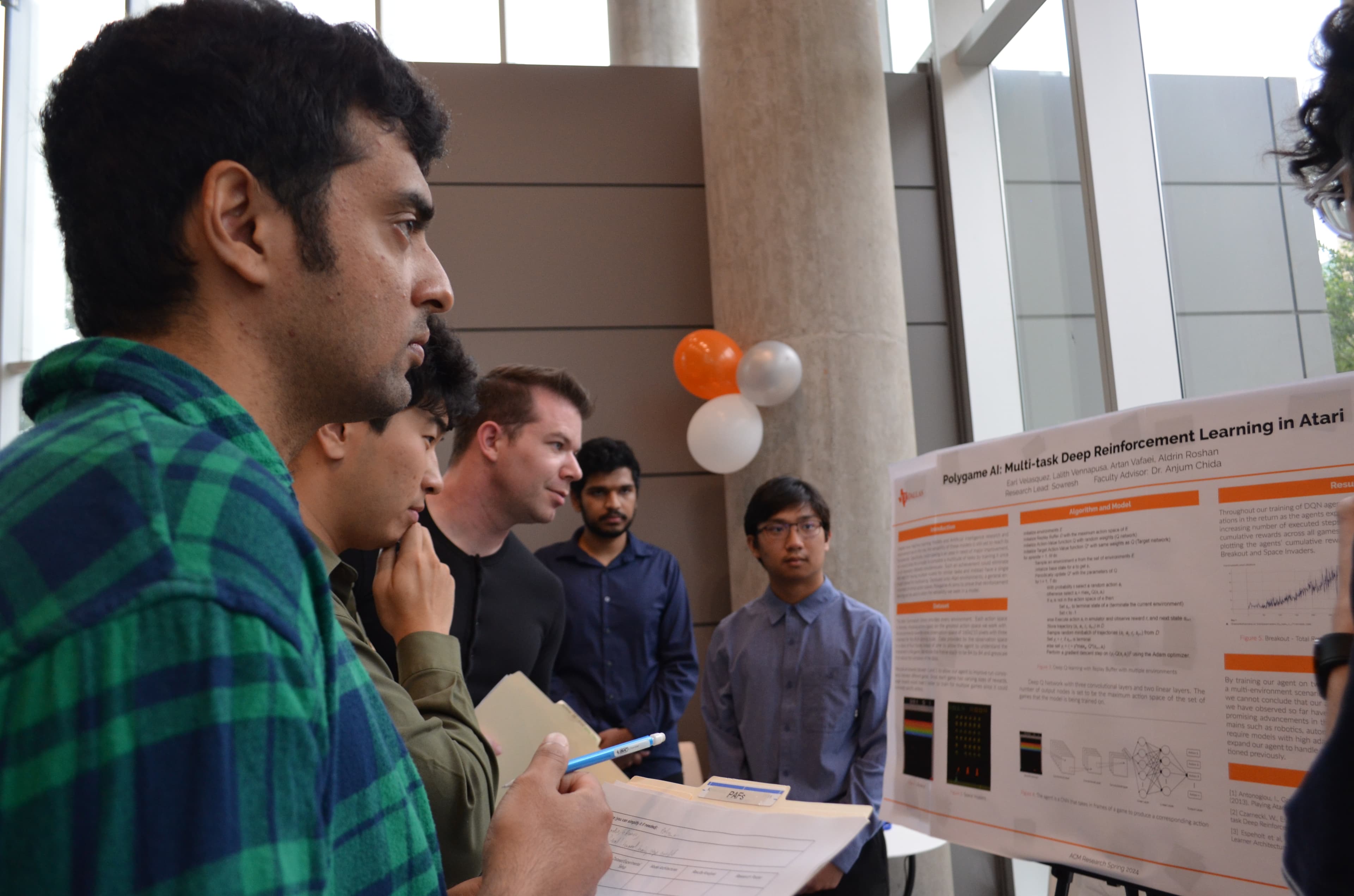 Judging of research project during the Spring 2024 symposium.